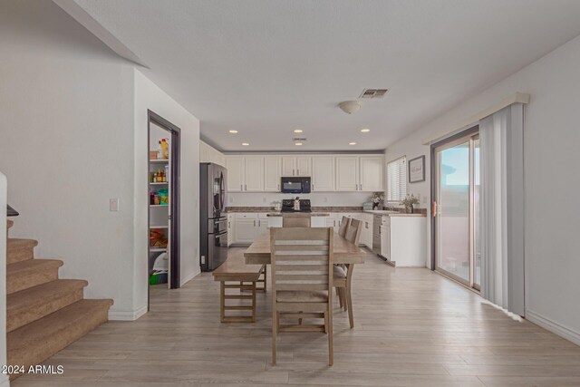 dining room with light wood-type flooring