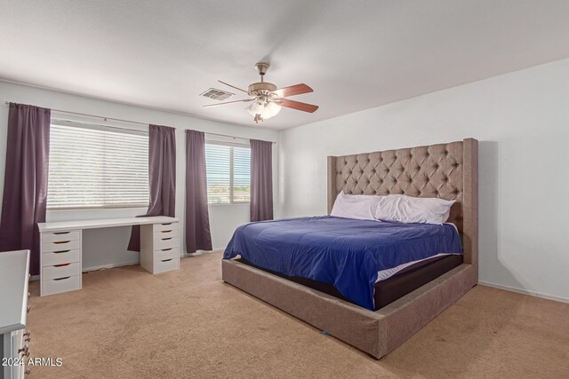 bedroom with light carpet and ceiling fan