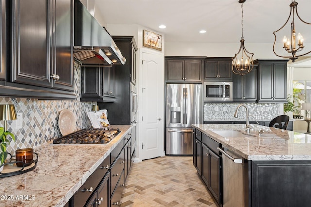 7511 S Parkcrest St, Gilbert, AZ 85298 - kitchen featuring stainless steel appliances, wall chimney range hood, a chandelier, backsplash, and brick patterned flooring