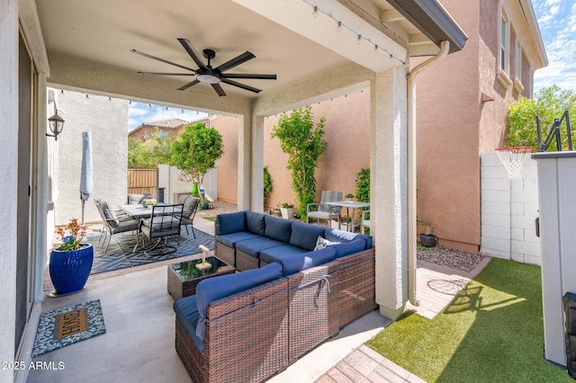 view of patio featuring outdoor dining area, an outdoor living space, and a ceiling fan