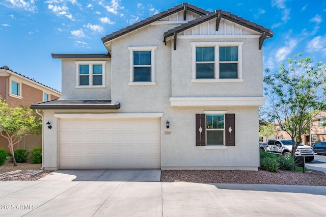 traditional-style house with concrete driveway, stucco siding, an attached garage, and board and batten siding