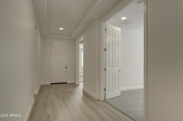 hall with light hardwood / wood-style flooring