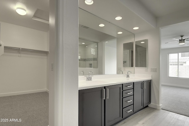 bathroom with vanity, wood-type flooring, and ceiling fan