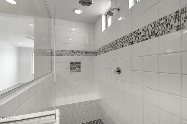 bathroom featuring a tile shower