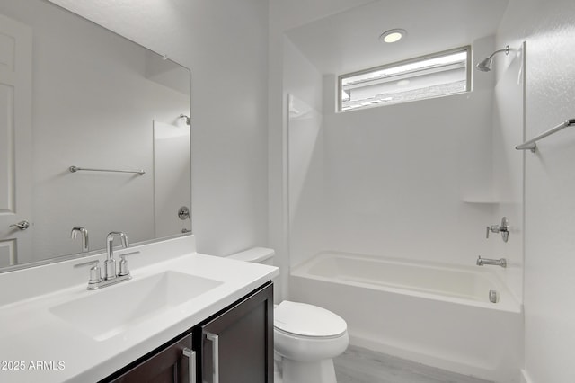 full bathroom with vanity, shower / bathing tub combination, and toilet