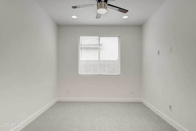 empty room featuring ceiling fan and carpet flooring