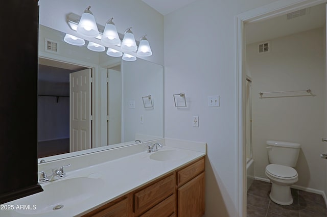 9355 N 91st St Unit 116, Scottsdale, AZ 85258 - full bath featuring toilet, tile patterned floors, a sink, and visible vents