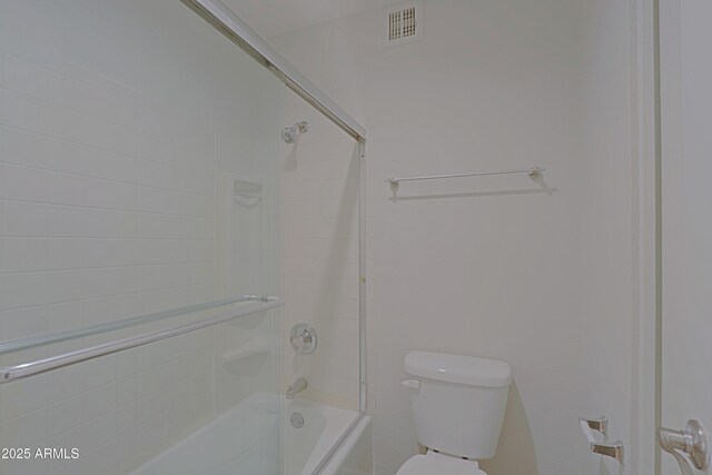 9355 N 91st St Unit 116, Scottsdale, AZ 85258 - bathroom featuring toilet, bath / shower combo with glass door, and visible vents