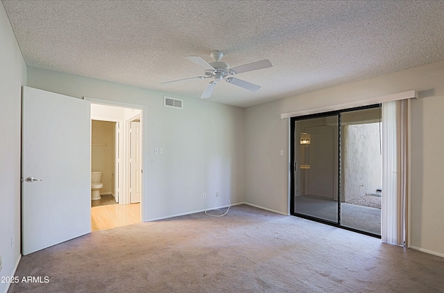 9355 N 91st St Unit 116, Scottsdale, AZ 85258 - unfurnished bedroom with a ceiling fan, a closet, visible vents, and carpet