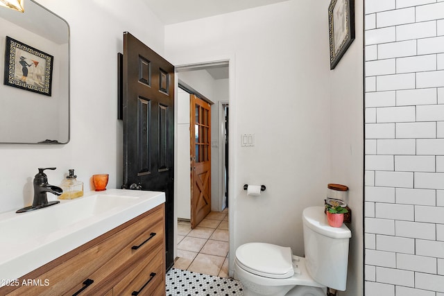 bathroom with tile patterned floors, toilet, and vanity