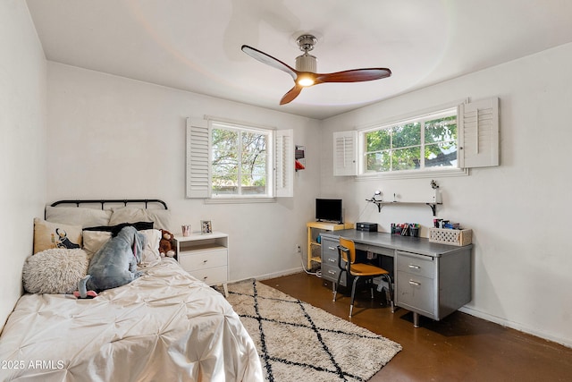 bedroom with multiple windows, baseboards, ceiling fan, and concrete flooring