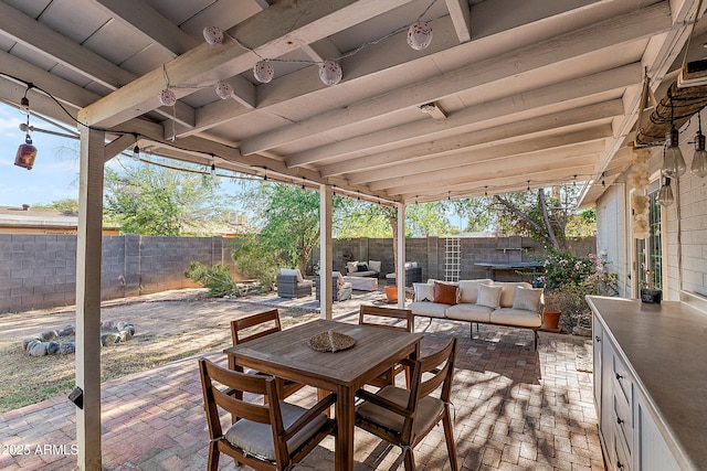 view of patio featuring an outdoor living space, outdoor dining space, and a fenced backyard