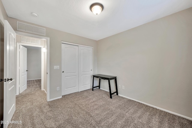 unfurnished bedroom with a closet and carpet