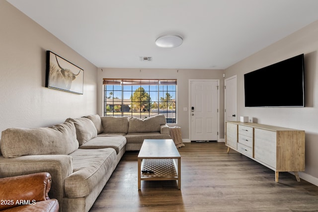 living room with dark hardwood / wood-style floors