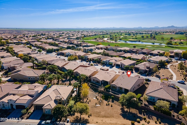 birds eye view of property featuring a water and mountain view