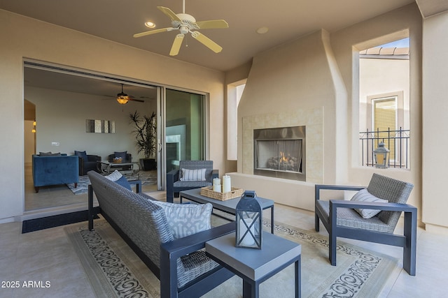 view of patio featuring an outdoor living space with a fireplace