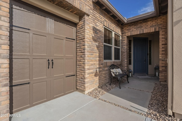 view of exterior entry featuring a garage