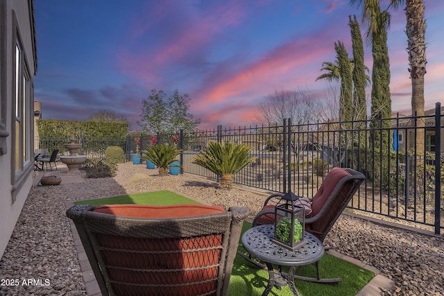 view of patio terrace at dusk