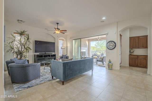 living room with ceiling fan and light tile patterned floors