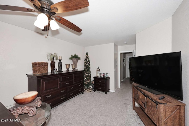 interior space featuring light colored carpet and ceiling fan