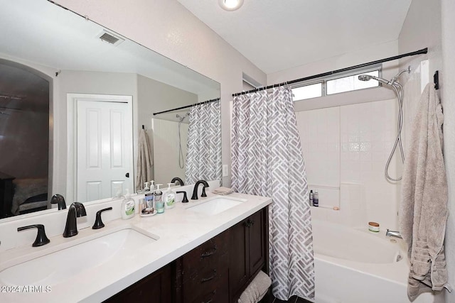 bathroom featuring vanity and shower / bathtub combination with curtain