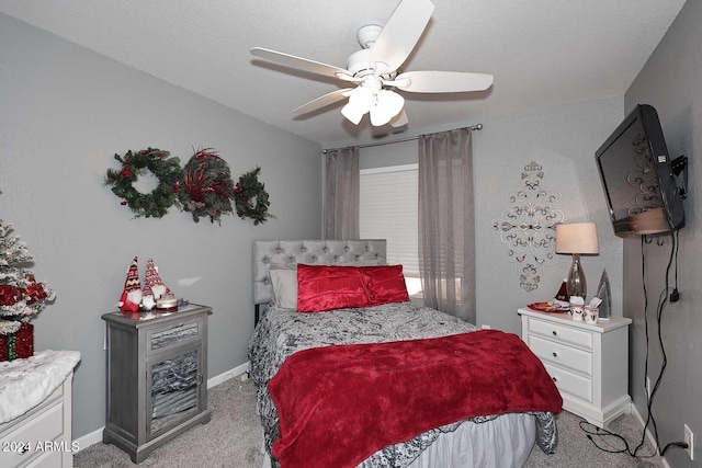 bedroom featuring ceiling fan and light carpet