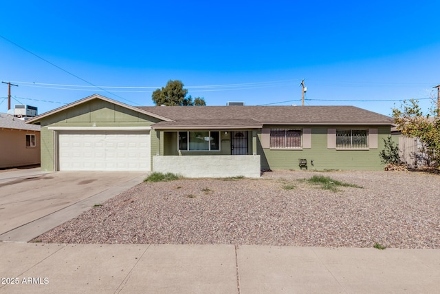 ranch-style home with an attached garage and concrete driveway