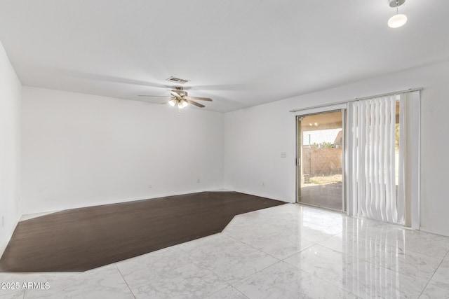 empty room featuring ceiling fan