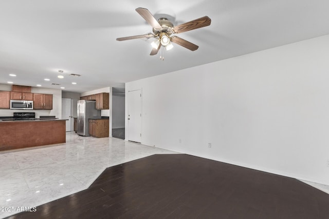 unfurnished living room featuring recessed lighting, ceiling fan, baseboards, and light wood finished floors