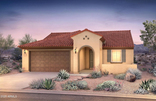 mediterranean / spanish home featuring an attached garage, stucco siding, concrete driveway, and a tile roof
