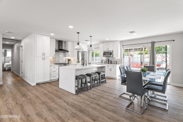 8714 E Plaza Ave, Scottsdale, AZ 85250 - dining area with wood finished floors, baseboards, and recessed lighting