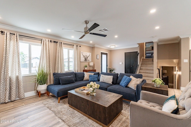 living room featuring recessed lighting, visible vents, light wood-style floors, stairs, and ornamental molding