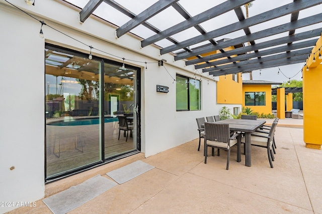 view of patio featuring an outdoor pool, outdoor dining area, and a pergola