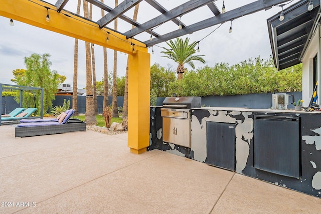 view of patio / terrace featuring a grill, an outdoor kitchen, and a pergola