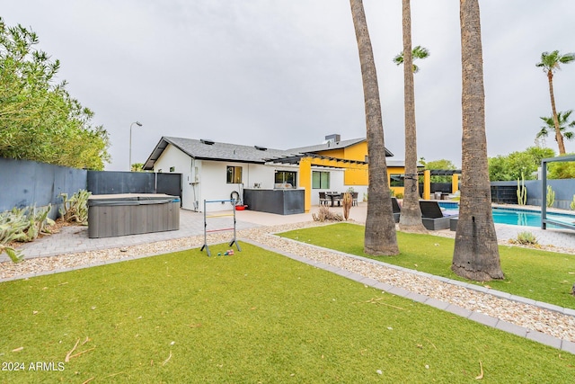 view of yard with a hot tub, a fenced in pool, a patio, a fenced backyard, and a pergola