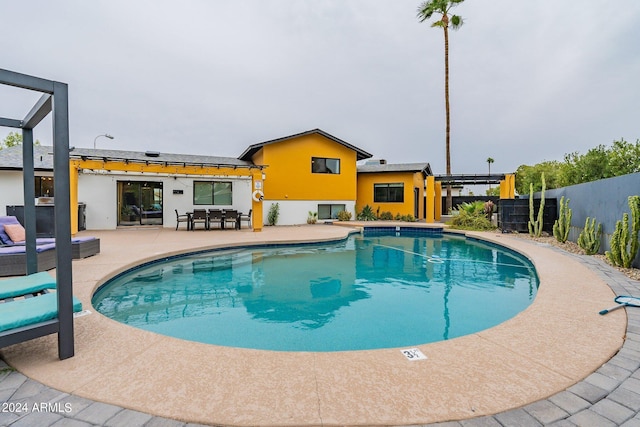 view of swimming pool with a fenced in pool, a patio area, fence, and a pergola