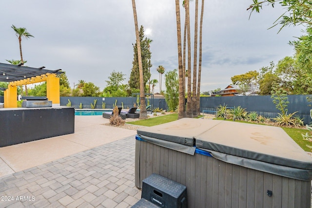 view of patio featuring a fenced in pool, a fenced backyard, a hot tub, and a pergola