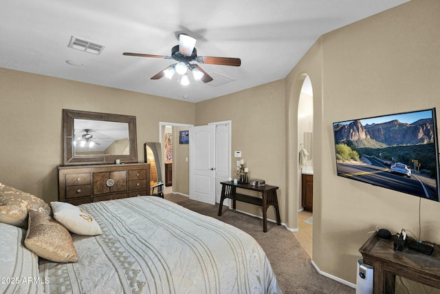 bedroom featuring light colored carpet and ceiling fan