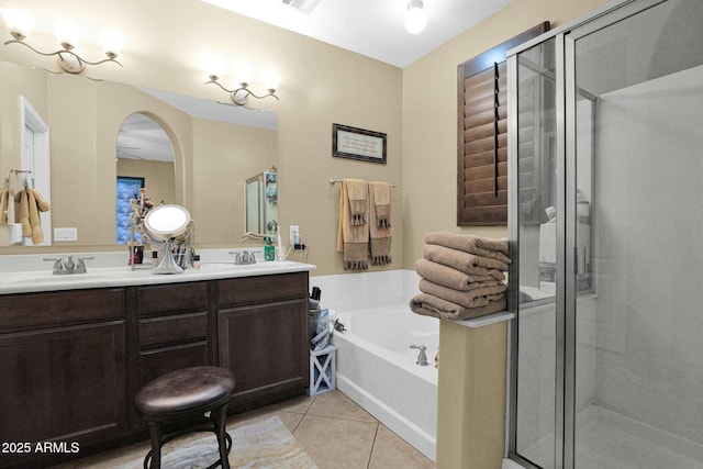 bathroom with vanity, independent shower and bath, and tile patterned flooring