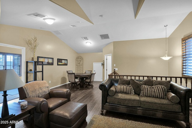 living room with dark wood-type flooring and vaulted ceiling