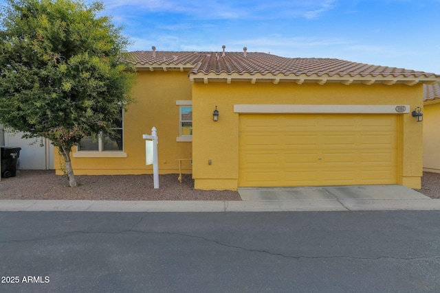 1161 S Storment Ln, Gilbert, AZ 85296 - mediterranean / spanish house featuring stucco siding, a tiled roof, and a garage