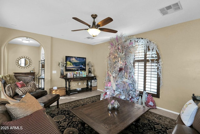 living room with light tile patterned flooring and ceiling fan