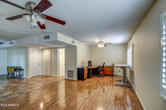 office space featuring ceiling fan and light hardwood / wood-style flooring