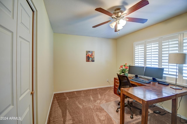 office space featuring light colored carpet and ceiling fan