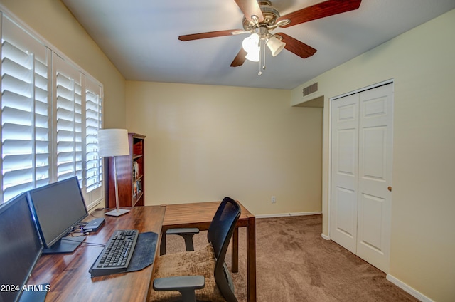 office area featuring ceiling fan and carpet floors