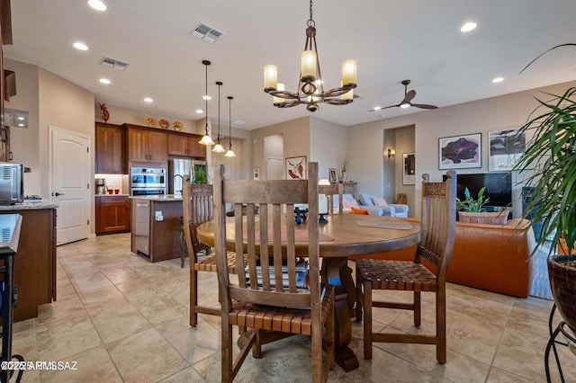 dining space featuring recessed lighting, visible vents, and a notable chandelier