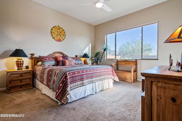 bedroom with baseboards, a ceiling fan, carpet, and vaulted ceiling