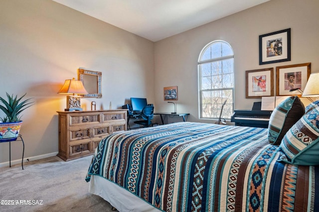 carpeted bedroom with baseboards