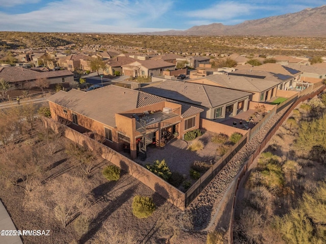 birds eye view of property with a mountain view and a residential view