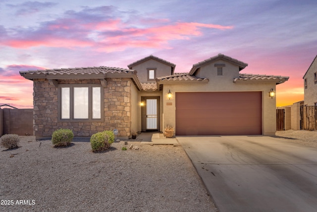 23886 W Harrison Dr, Buckeye, AZ 85326 - view of front of house with concrete driveway, a garage, stucco siding, and a tile roof